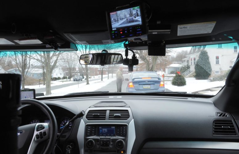 Mirror photo by Gary M. Baranec / A Logan Township police officer talks to a driver during a pullover on Friday. Logan Township police are planning to have  officers wear body cameras starting in January or February, in addition to their in-car cameras (shown above).
